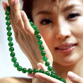 A model shows a jadeite necklace during a press preview for Sothebys precious jewels in Hong Kong on Tuesday.  The jadeite necklace, estimated at a price of nearly $3.2 million, is set to be part of the Sothebys Autumn Auction slated for October 25.