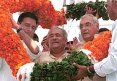 Mr Ram Prakash, flanked by Chief Minister Bhupinder Singh Hooda and outgoing Working President of the HPCC Randeep Singh Surjewala at a function to mark Mr Ram Prakashs appointment as HPCC Working President at Haryana Congress Bhavan in Chandigarh