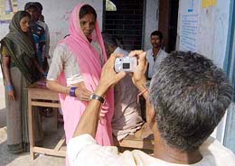 A voter being  photographed before going to cast her vote at a polling station at Jahanabad in Bihar during the first phase of Assembly elections on Tuesday. The Election Commission has introduced this practice for the first time in the country.