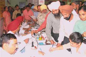 Doctors and paramedical staff conduct preliminary tests and examination of those opting for vasectomy operations at a special camp held at the Civil Hospital in Ludhiana on Tuesday