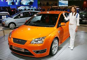 A model poses with a Ford Motors Focus ST at the Tokyo Motor Show in Chiba