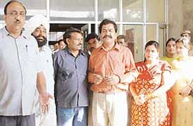Congress-supported councillors of the Panchkula Municipal Council come out dejected after their failure to oust MC chief Tarun Bhandari on Wednesday