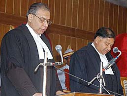 Mr Justice Vijay Kumar Jhanji (left) being administered oath by Chief Justice Vinod Kumar Gupta at the HP High Court, Shimla, on Wednesday.