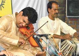 Johar Ali plays the violin under the aegis of SPIC MACAY at GRD Academy, Ludhiana, on Wednesday