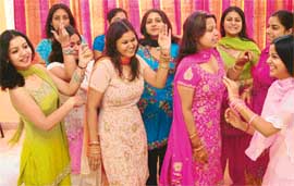 Young decked-up gals and pretty women on a wonderful high, as they have a big-time Karva bash.
