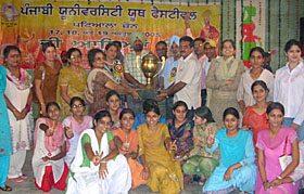 The winning GCG Patiala team receives the overall trophy of Punjabi University Youth Festival from the Managing Director of PRTC, Mr Gurinder Singh Garewal, at Government Mohindra College in Patiala, on Wednesday.