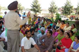 Teachers protest against electoral duties given to them outside the PUDA office on the Ferozepore Road in Ludhiana on Thursday