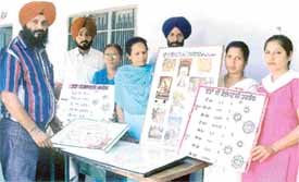 The coordinator of teaching programme, Mr Davinder Singh Chhina, monitors the teaching aids prepared by teachers at Shaheed Kartar Singh Government Senior Secondary School, Sarabha, on Thursday