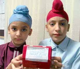 Varinder Pal Singh and Gurvinder Singh who have donated their piggybank savings for earthquake victims in Ludhiana on Wednesday