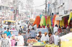 A view of Jail Road that has been drastically narrowed down due to roadside encroachments