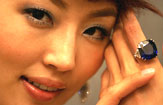 A model displays an unheated, natural Burmese sapphire ring during a Sothebys press preview in Hong Kong on Friday.