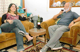 A quiet evening at home with friends sharing thoughts and wine