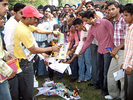 Students of DAV College burn prospectuses and fee receipts of the college in Bathinda on Friday.