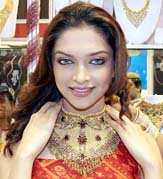 Model Deepika Padukone showcases a necklace at the inauguration of a jewellery fair in Bangalore on Saturday.