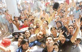 Cricket lovers queue up at the PCA Stadium on Saturday to buy tickets for the ODI to be played in Mohali. 
