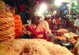 A shopkeeper selling feni near Jama Masjid during the ongoing Ramjan festival in the Capital on Saturday