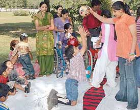 Chahat Puri interacts with special children at the Rose Garden in Ludhiana on Saturday. 
