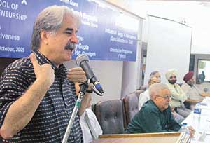 Mr Fred Ebrahami, Chairman, Quark Media, addresses working professionals during an orientation programme at PTUs Gian Jyoti School of TQM and Entrepreneurship in Mohali on Sunday.