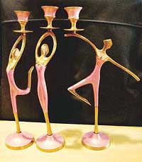 Dancing figures to hold the candles