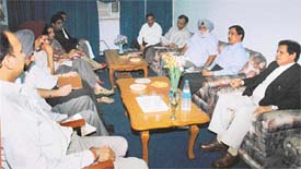 Mr Justice HS Bedi, Executive Chairman of the State Legal Services Authority, presides over a meeting of top officials in connection with state-level lok adalat to be held in Ludhiana on Monday