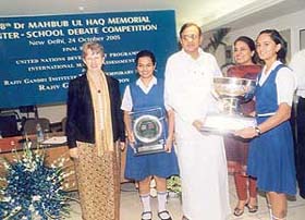 Prakriti Sharma and Ceapum Kaushish receive a trophy from Finance Minister P. Chidambaram in New Delhi