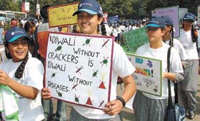 Schoolchildren participating in a Human Chain Walkathon to spread the message of not using crackers on Divali at Jantar Mantar in the Capital