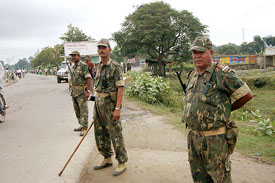 Central Reserve Police Force jawans keep vigil at a Hajipur road in Vaishali district in Bihar on Tuesday