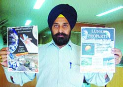 Harjinder Singh Baghi shows his lunar property documents.