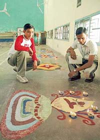 Participants watch rangoli at the PU Zonal Youth Festival at Government College, Sector 11, Chandigarh