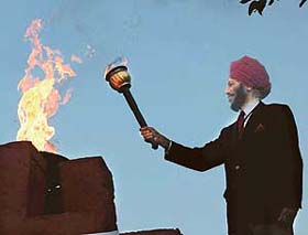 Flying Sikh, Mikha Singh, lights the flame of 1st Chandigarh State Games at the Football Stadium, Sector 17, Chandigarh