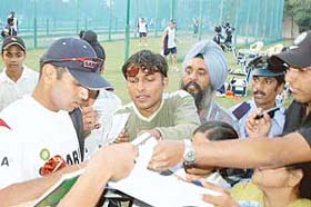 Indian captain Rahul Dravid gives autographs to his fans on the eve of the second one-day international cricket match at the PCA Stadium Mohali