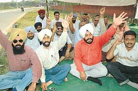 Members of the MES Contractors Association hold a protest in support of their demands outside 3 BRD in Chandigarh