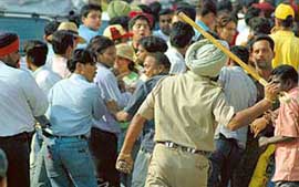 Fielding the crowd: Busy with what the Punjab Police is best at. Cricket buffs had a bad day outside the PCA Stadium at Mohali on Friday.