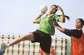 Rooman of Coaching Centre, Sector 42, jumps to score a point against Coaching Centre, Sector 23, Chandigarh, during 1st Chandigrh State Games at DAV School, Sector 8, Chandigarh, on Friday.