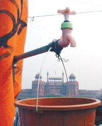 A replica of a dry tap to symbolise the water scarcity in Chandni Chowk in the Capital on Friday.