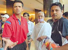 Rahul Dravid reacts sharply to the crowd as his meeting with spiritual leader Alok Muni Vinay Kumar is interrupted 