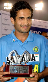 Irfan Pathan holds the trophy after being declared the man of the match in the second one-dayer against Sri Lanka in Mohali on Friday