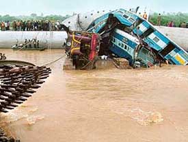 Engine and compartments of the Secunderabad-Rippali Delta passenger train that fell into a rivulet after derailing in Nalgonda district of Andhra Pradesh on Saturday.