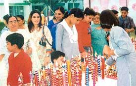 Parents admire the candles made by students of BCM School in Ludhiana