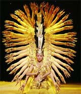 Members of a Chinese dance troupe formed by physically challenged persons, display the shape of Thousand Armed Avalokiteshvara, the Buddha of Compassion