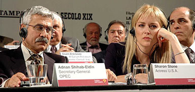 Acting Secretary-General of OPEC Adnan Shihab-Eldin (left) and US actress Sharon Stone attend an energy conference in Rimini, Italy, on Sunday. Eldin said that oil companies with surging third-quarter profits should use the money to increase their refining capacity and help ease pressure on oil prices.