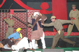 Theatre artistes in action during the mela on Sunday.