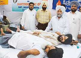 Volunteers of the Congress donate blood to mark the death anniversary of Mrs Indira Gandhi in Chandigarh on Monday.