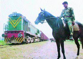 A BSF jawan escorts the Samjhauta Express on the Indian territory