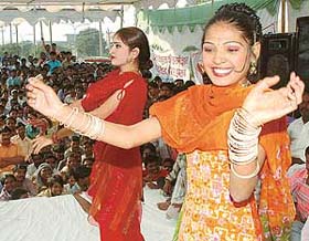 Orchestra dancers present an item number to mark Vishvakarma Day at Sector 16, Panchkula