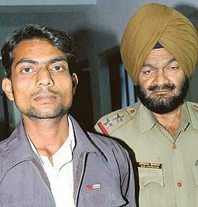 Neeraj, one of the suspect who morphed a picture of a girl to extort money, in police custody