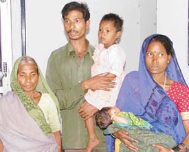 Jeevan Lal with his wife, mother and two kids, who were rescued by a Phillaur-based NGO from illegal detention at a brick-kiln in Pathankot, in Ludhiana on Wednesday. 