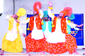 Students of St. Soldier College perform Bhangra during the zonal youth festival in Jalandhar on Thursday. 