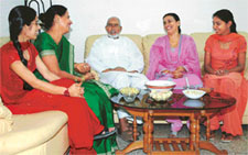 Raziq Ahmed and his wife with neighbours