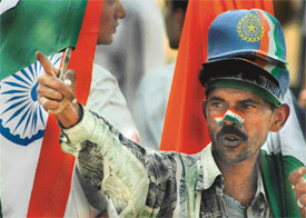 This man, along with his group, goes around the country following the Indian cricket team, selling flags and caps